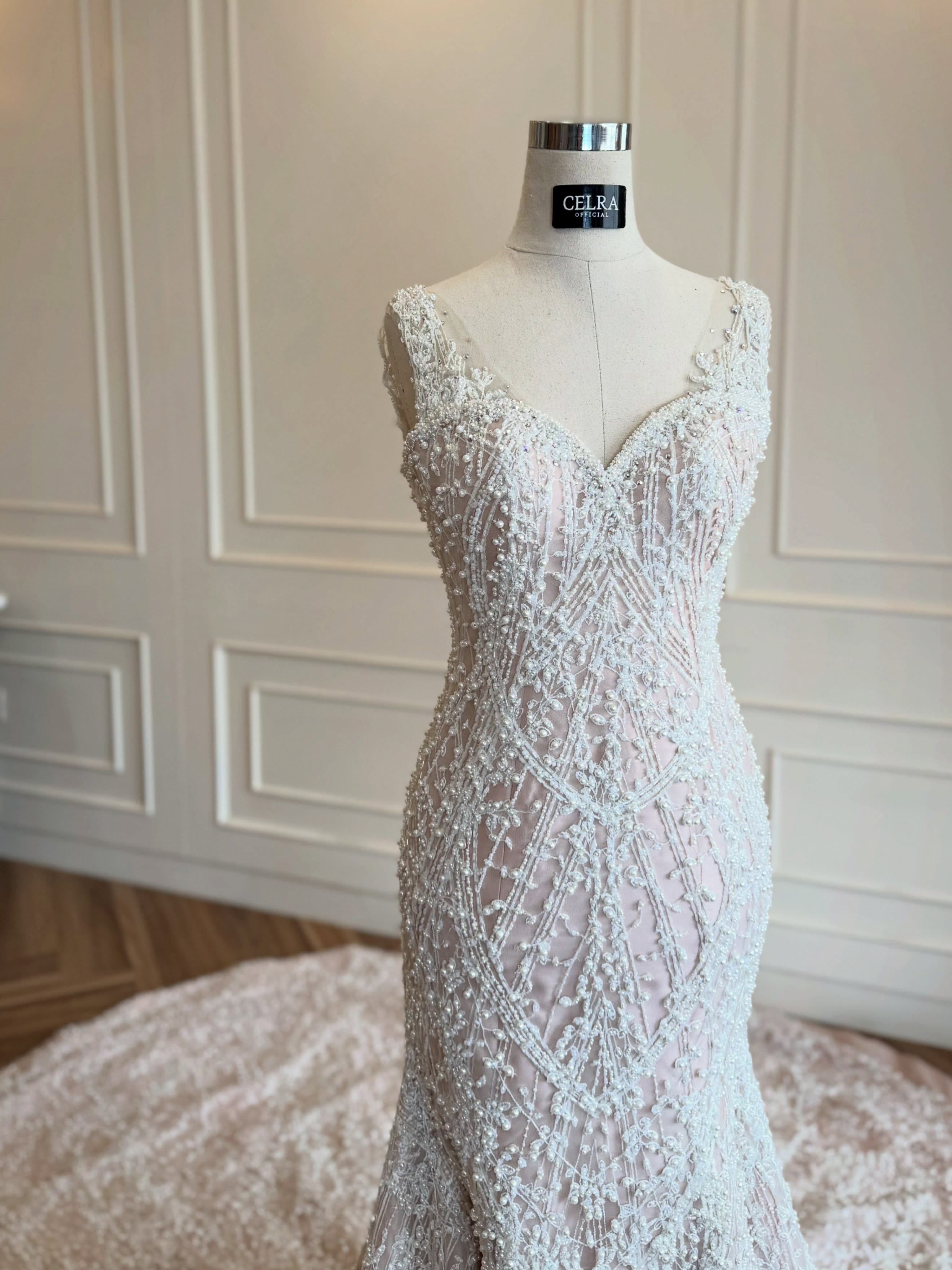 Close-up of the beaded sweetheart bodice of a mermaid wedding gown by CELRA