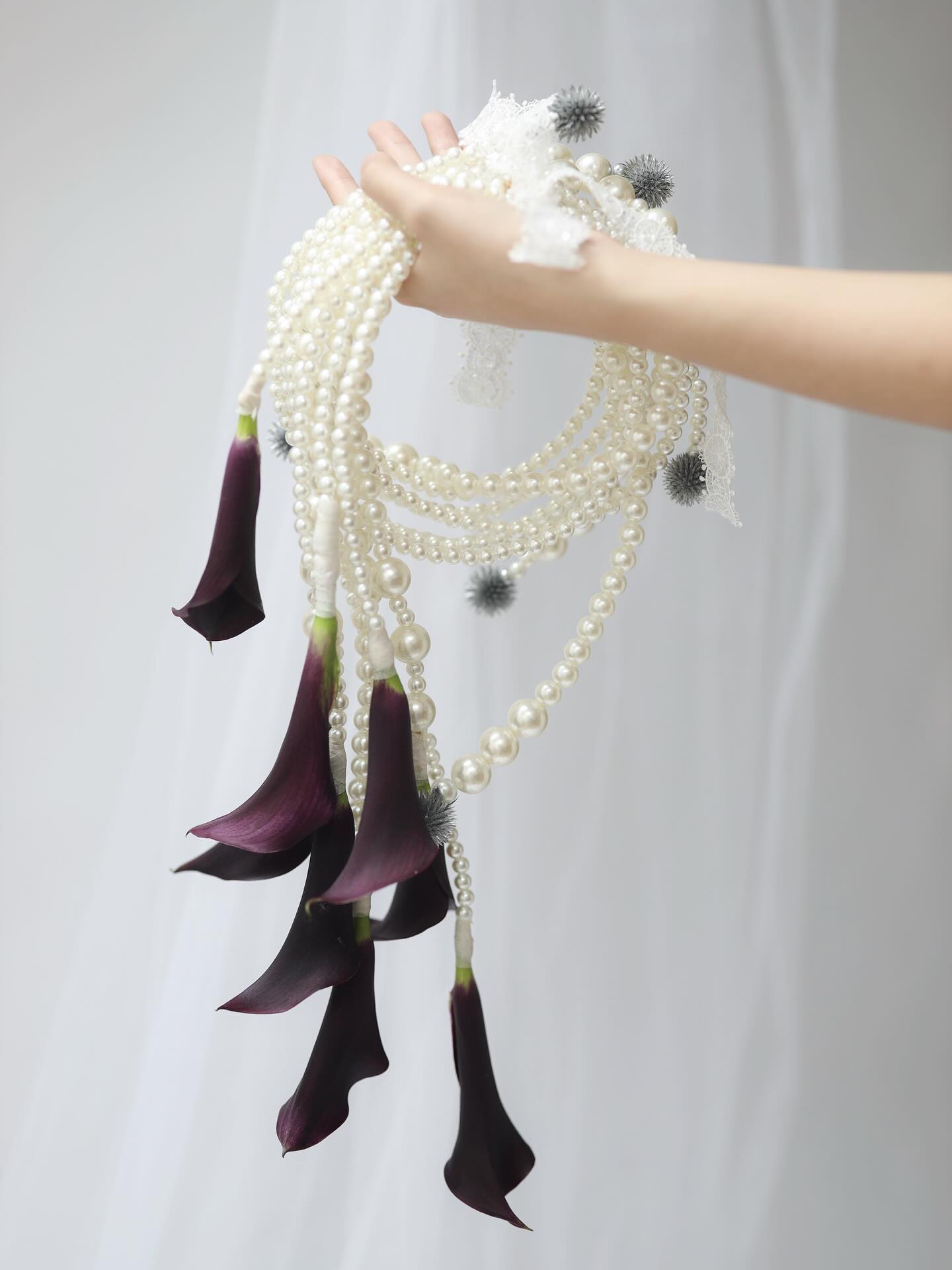 Bridal bouquet of pearls and dark calla lilies by CELRA