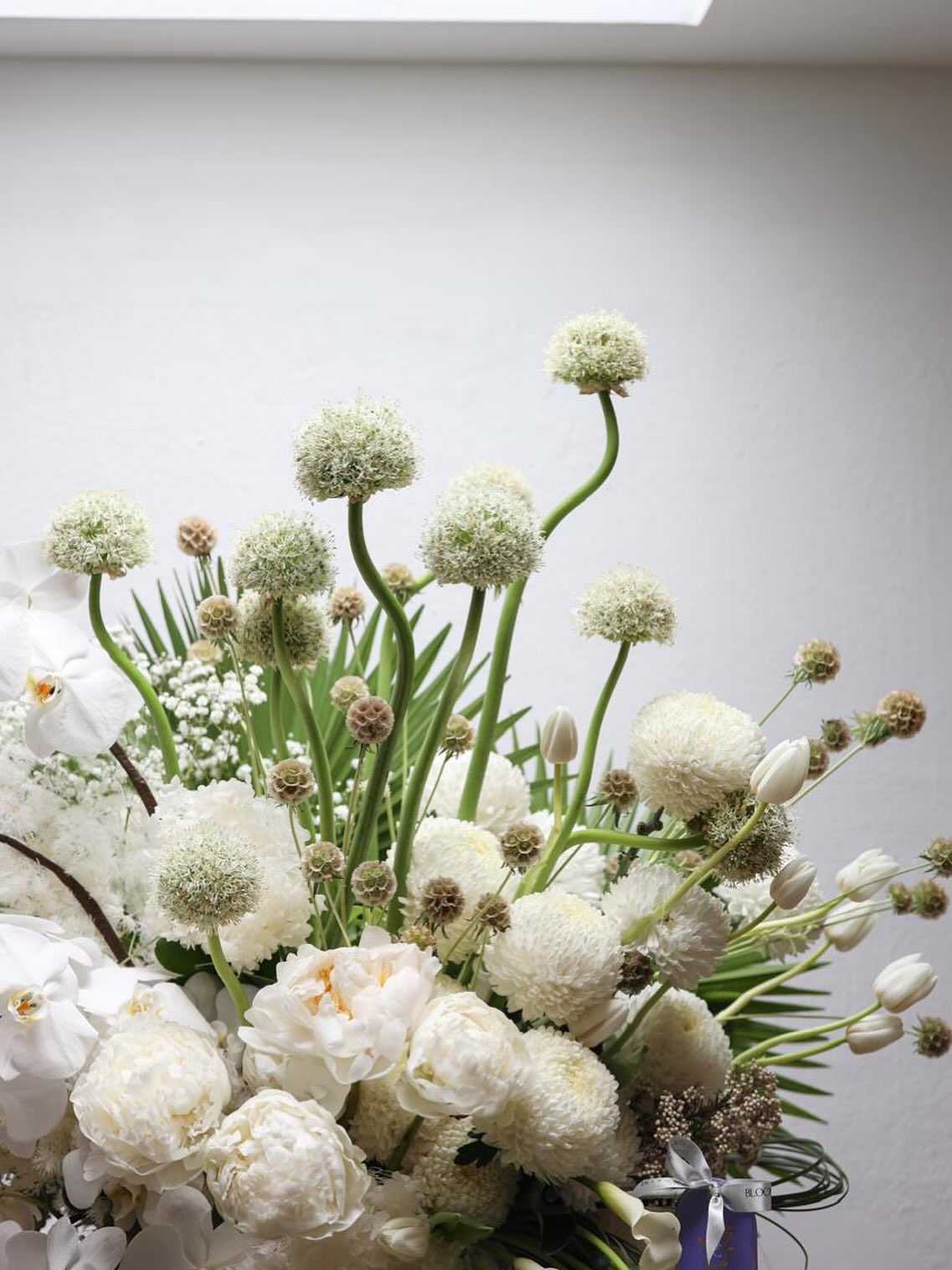 White peonies and allium arrangement