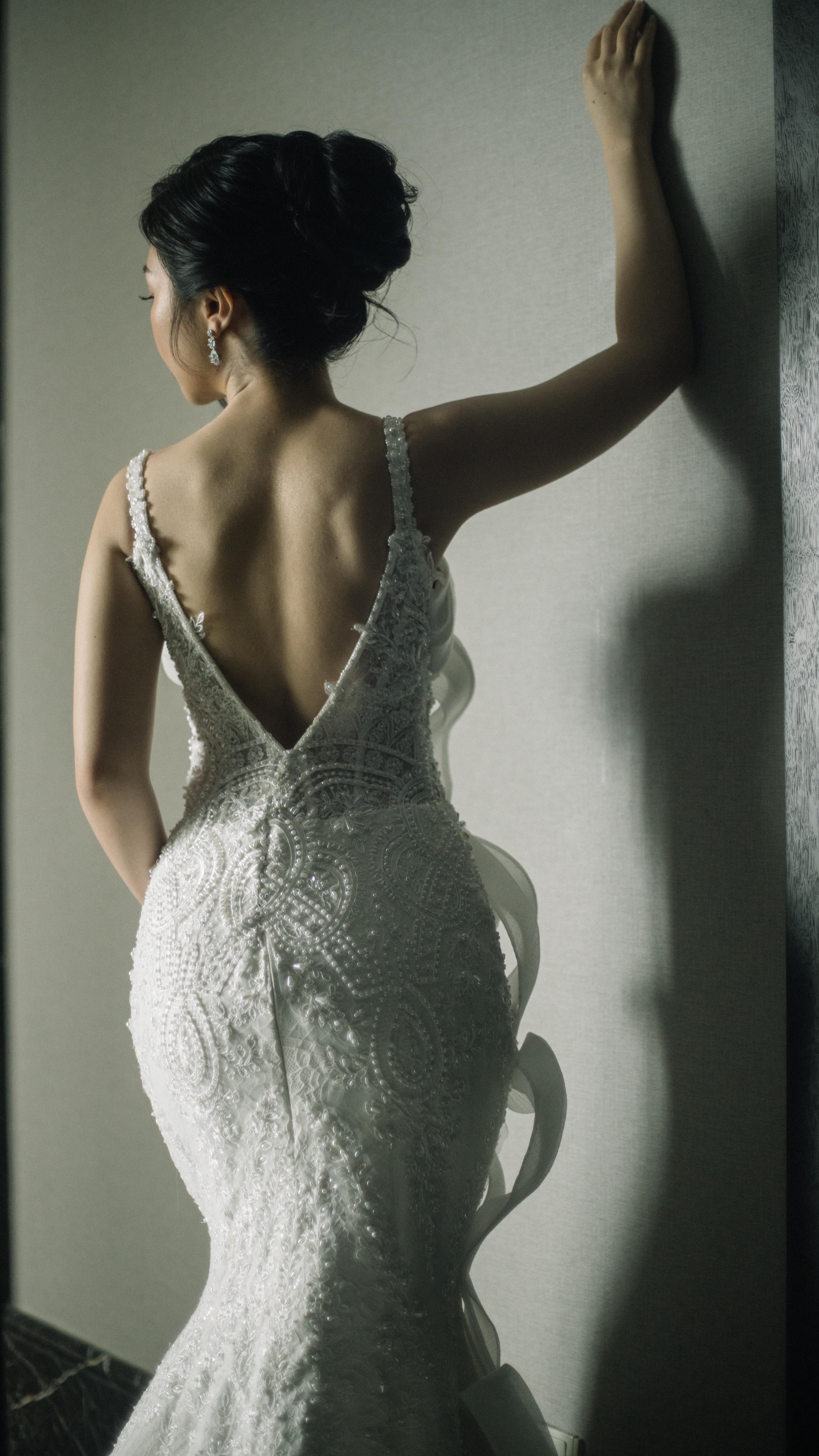 Backless beaded mermaid wedding gown with ruffle detail by CELRA