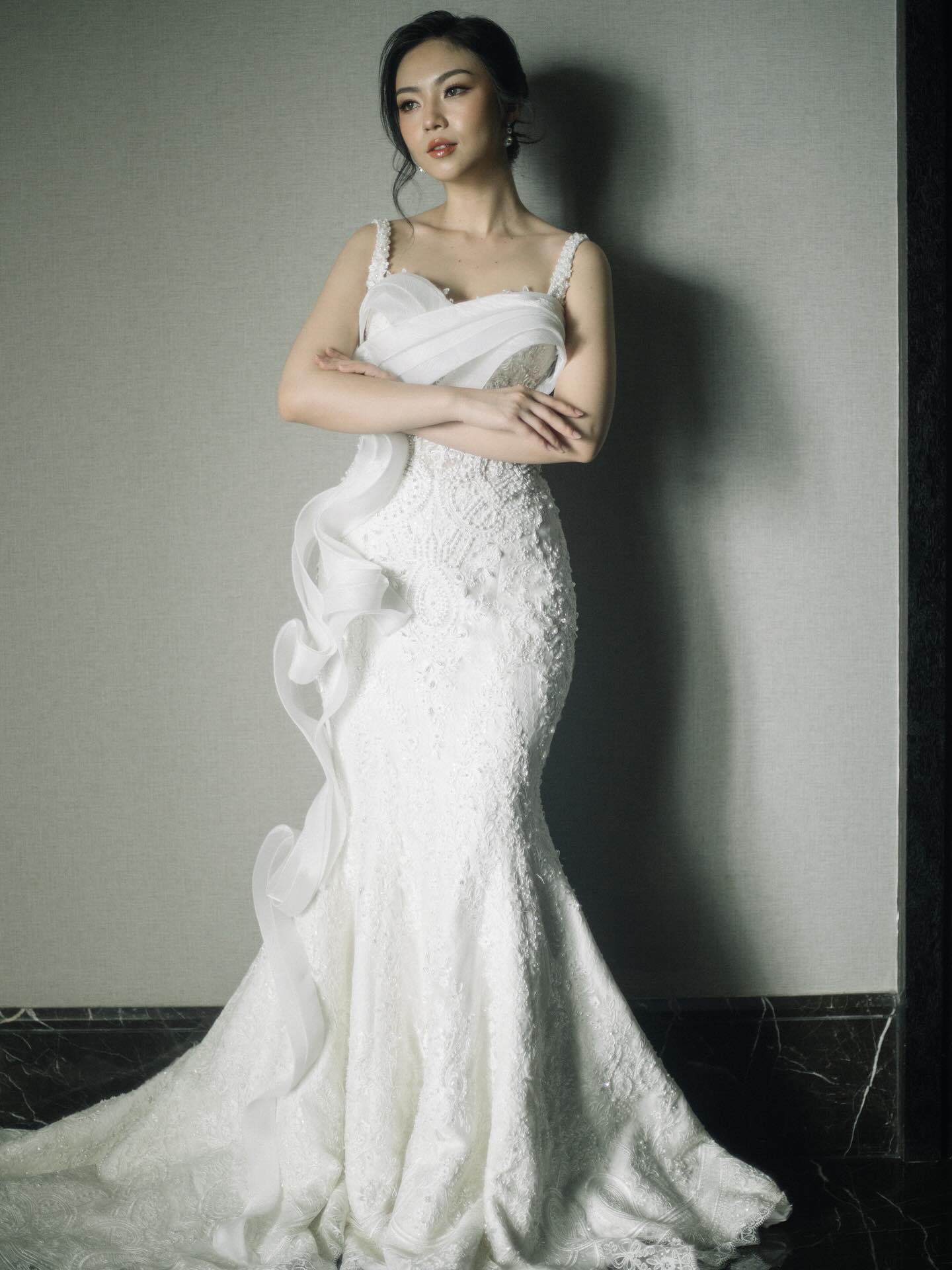 Bride in a draped mermaid gown by CELRA