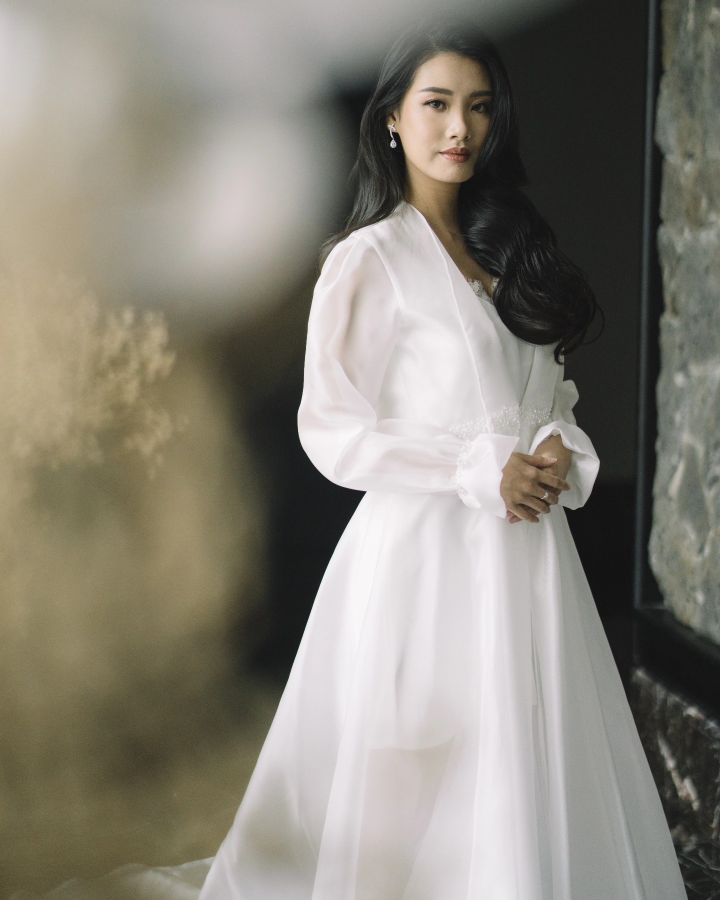 Bride in a sheer organza gown with long sleeves by CELRA