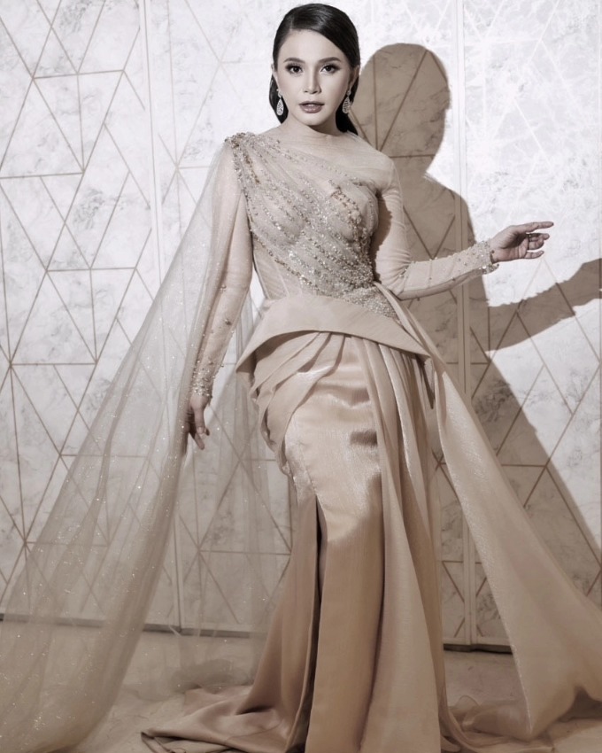 Champagne gown with sheer cape and draped overskirt by CELRA