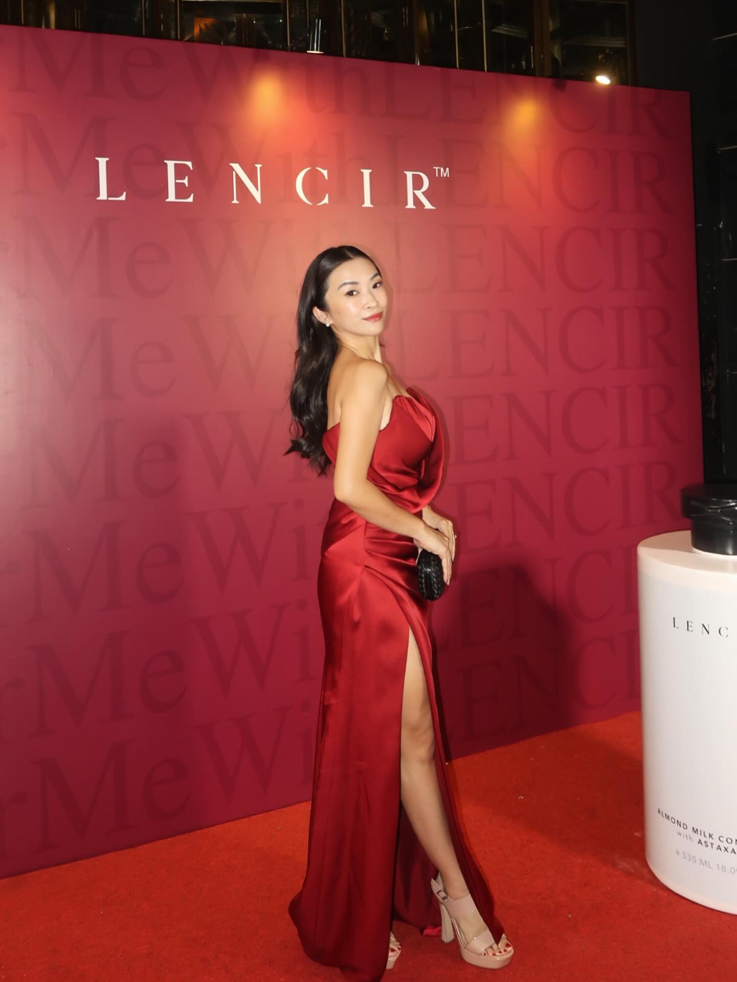 Red satin gown with slit at an evening event — CELRA.id rental