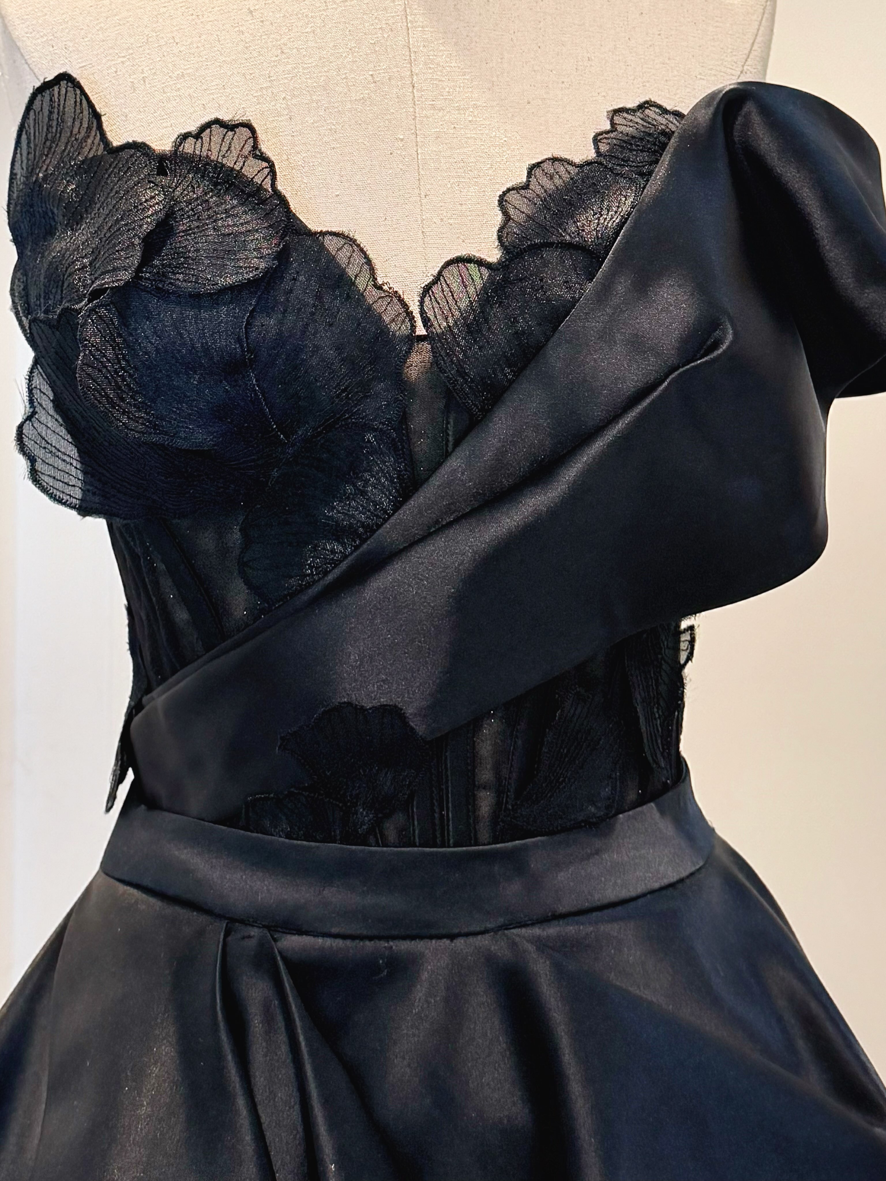 Black satin gown with lace-trimmed neckline — CELRA.id rental