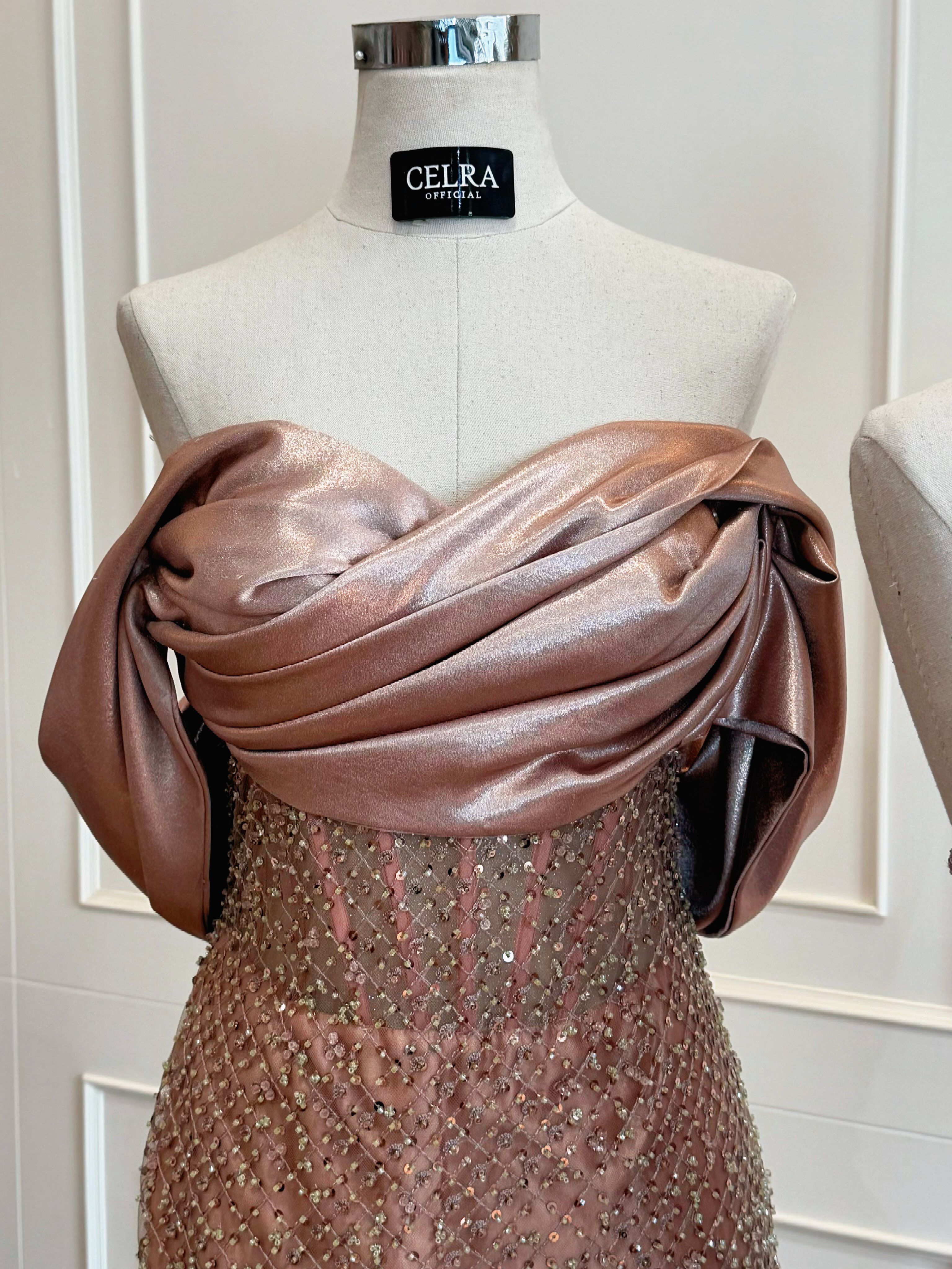 Rose-gold satin gown with draped neckline — CELRA.id rental