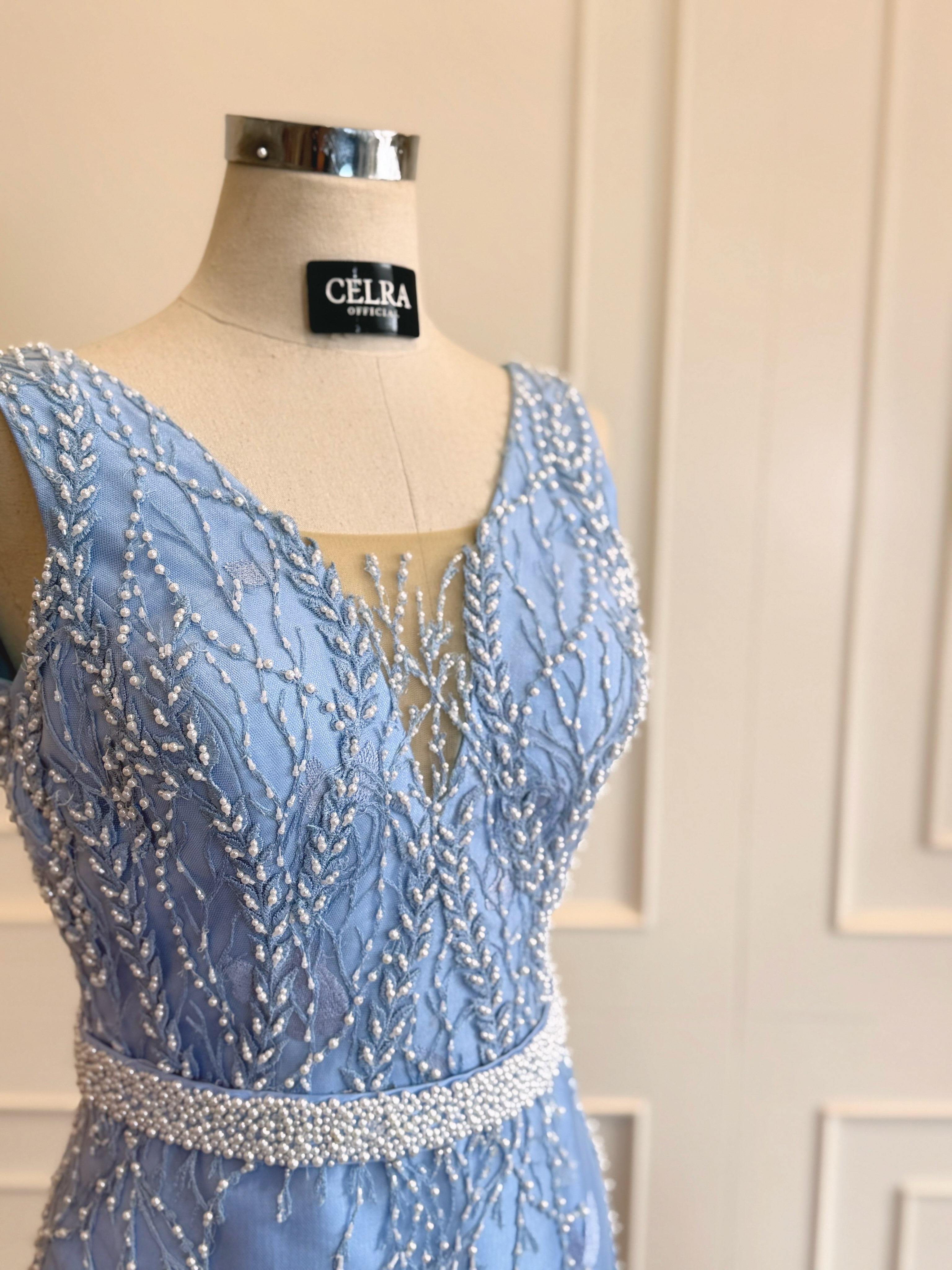 Blue beaded gown on a mannequin — CELRA.id rental