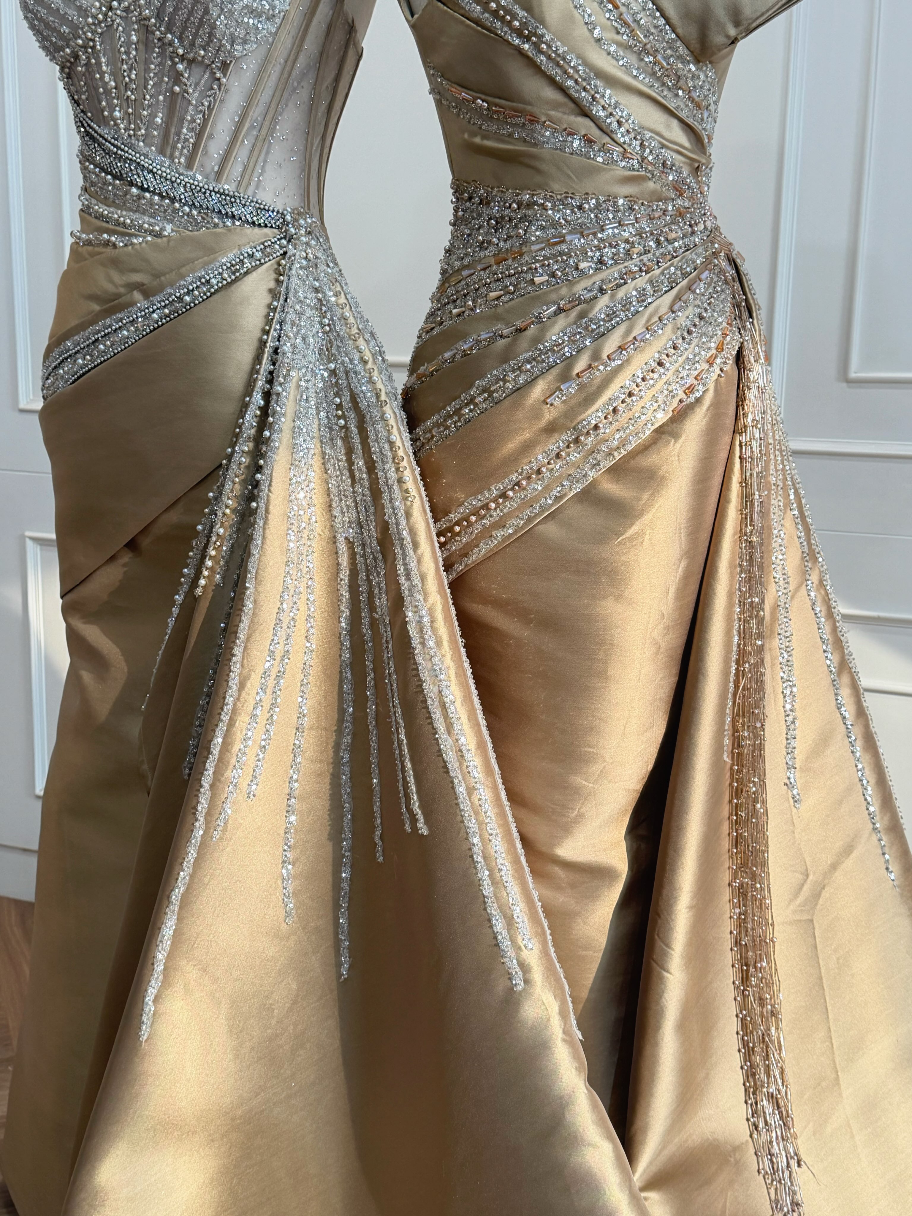 Gold draped gowns on mannequins — CELRA.id rental